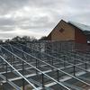 A pitched roof conversion to an existing external plant deck at a retirement village